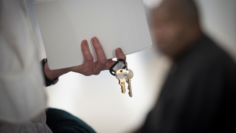 Person holding keys to new affordable housing. Photo by Ed Reed/Mayoral Office of Photography.
