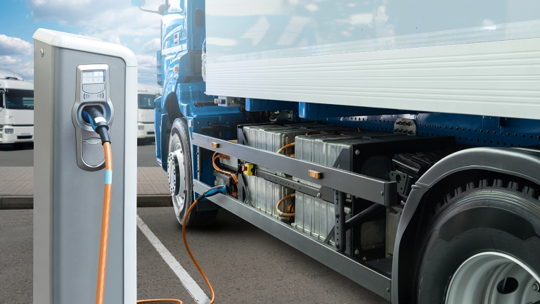 Conceptual rendering of electric truck batteries that are bring charged from the charging station.